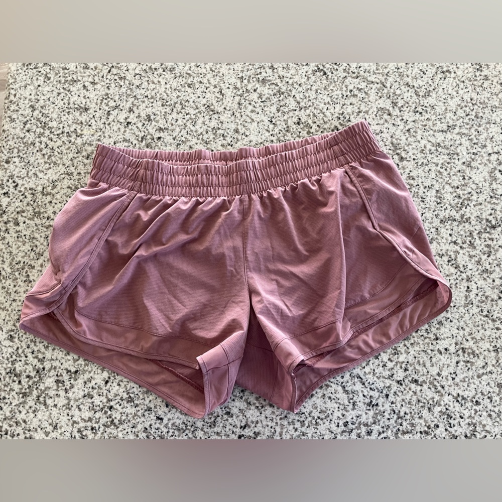 Athleta 2.5 in. Inseam lined, mauve athletic shorts. Side zipper pocket. Size L